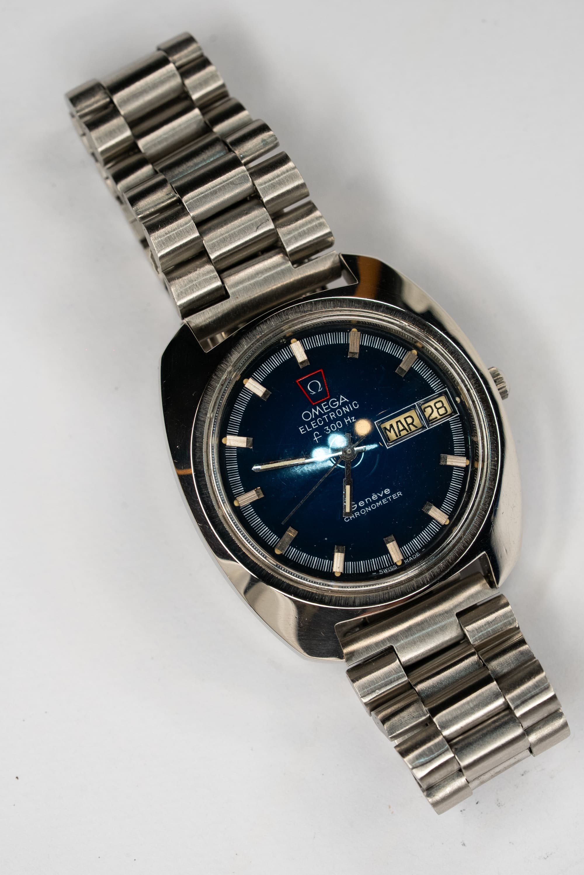 A vintage Omega with a deep blue dial on a steel bracelet